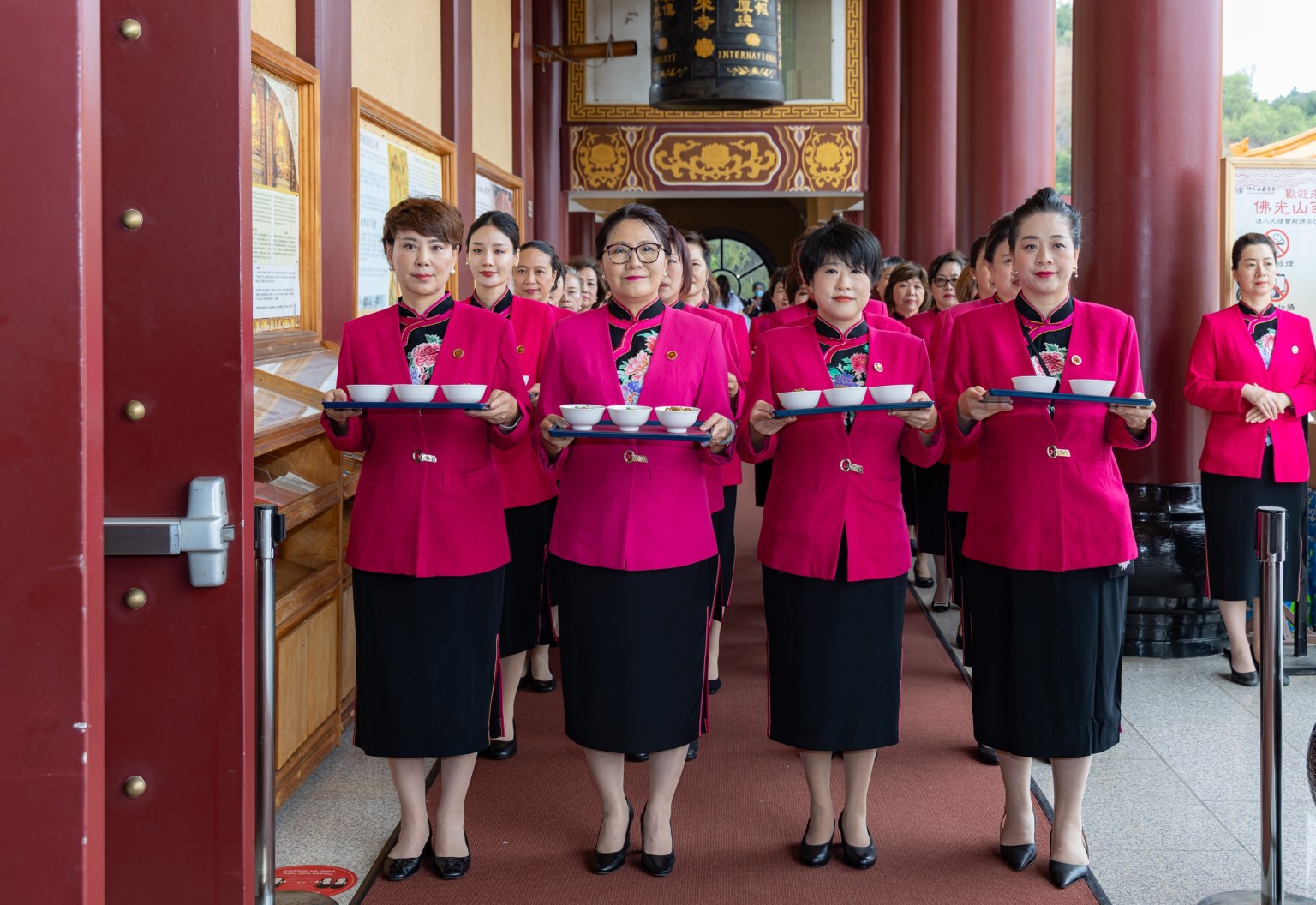 The dignified reception team serves as the first offering procession.