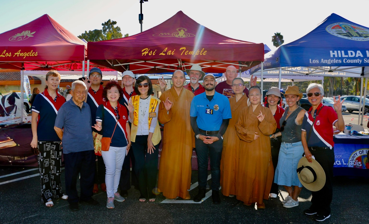 Ryan Serrano, Deputy Director for Los Angeles County District 1, poses for a photo with members of the Fo Guang community.