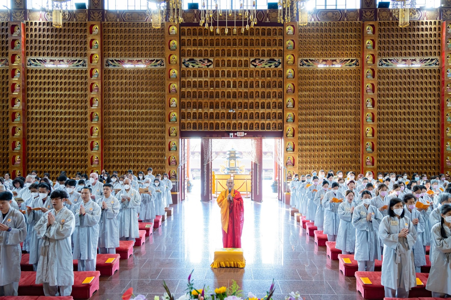 Venerable Huidong and the monastics lead participants in combined Chan and Pure Land practice through collective Buddha-name chanting, gathering body and mind in mindful concentration.