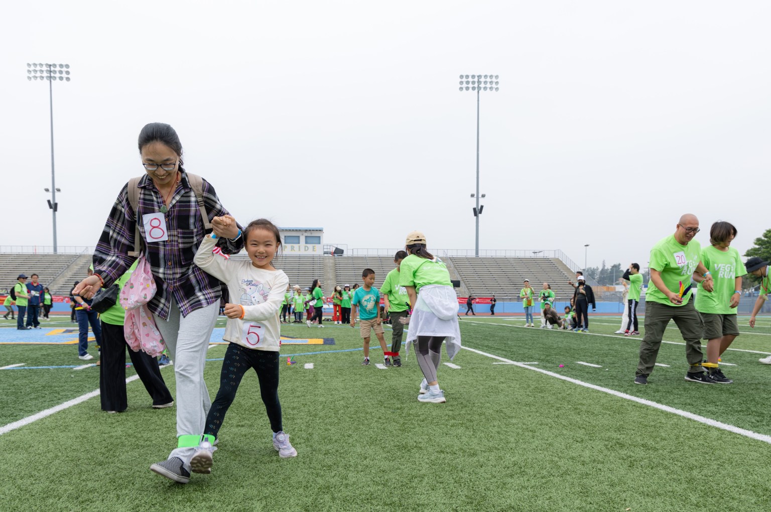 Laughter fills the air during the three‑legged race.