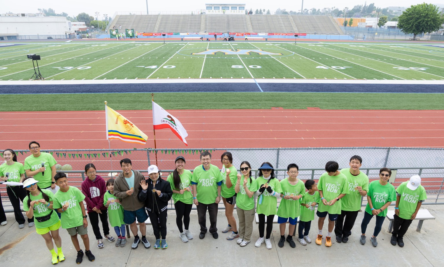 Diamond Bar Mayor Jiayou Deng presents the Best Participation Award to those who completed more than eight laps in running or walking.