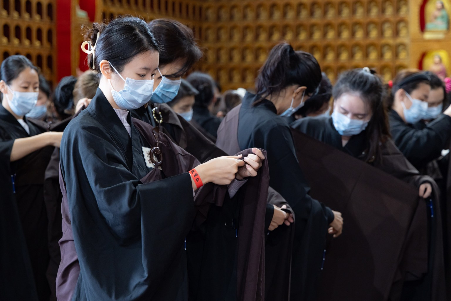“Excellent is the robe of liberation, noble is the garment of repentance and reverence. I now receive and wear it, paying homage to the Buddha and seeking repentance.”