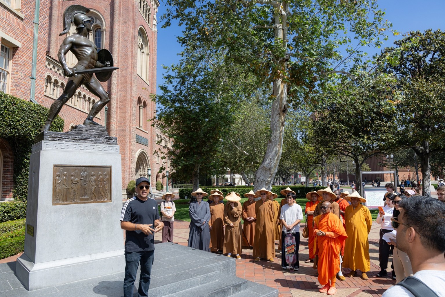 Varun Soni, Dean of Religious and Spiritual Life at the University of Southern California, delivers welcoming remarks in front of the Tommy Trojan statue.