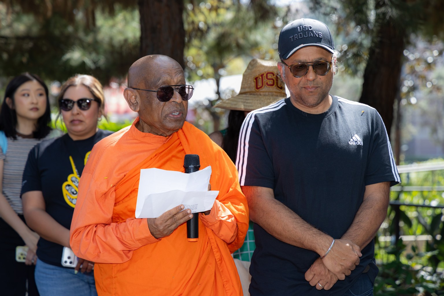 Venerable Piyananda Walpola delivers a Dharma talk beneath the Bodhi tree.