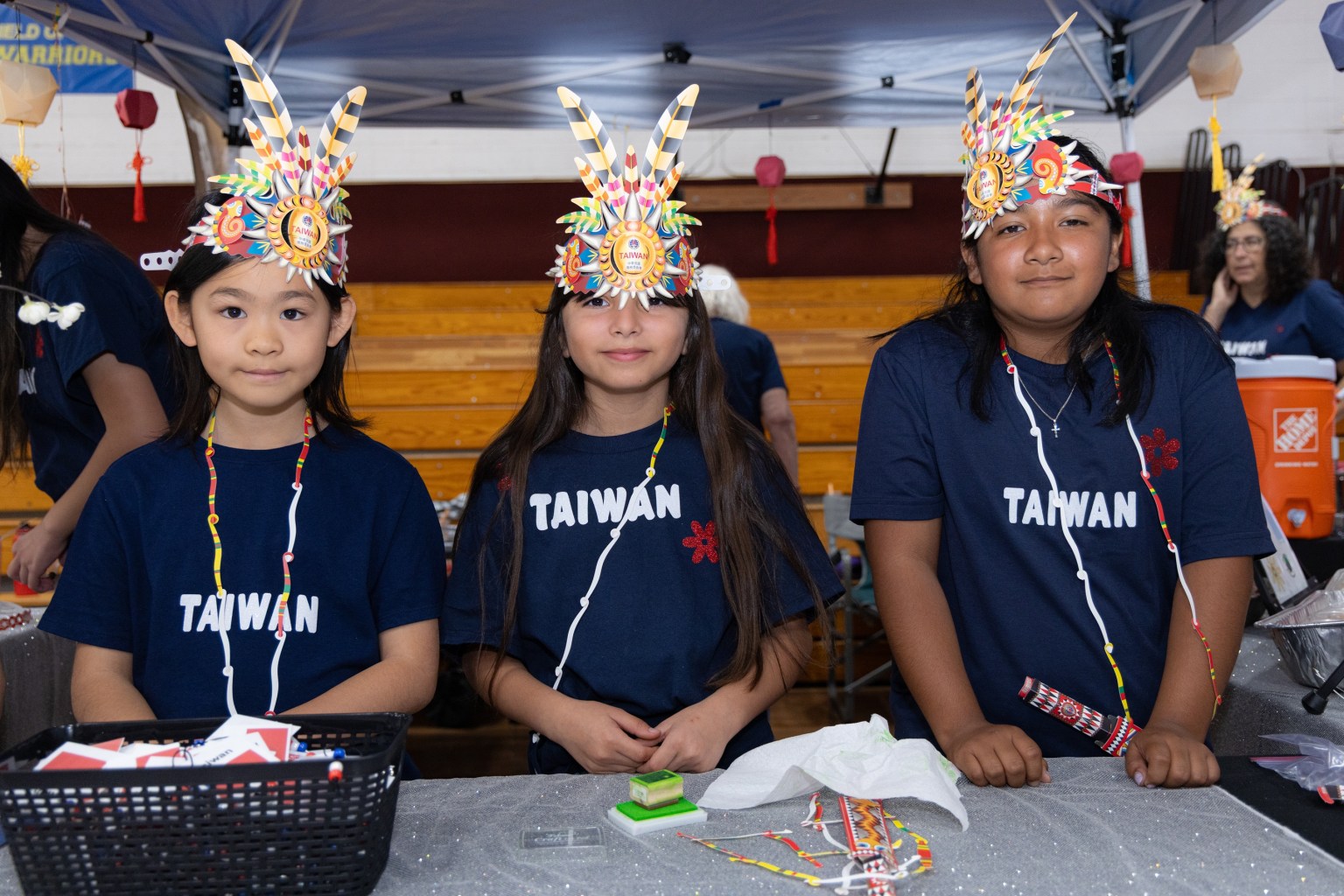 Girl Scouts representing Taiwan wear traditional Indigenous headdresses.