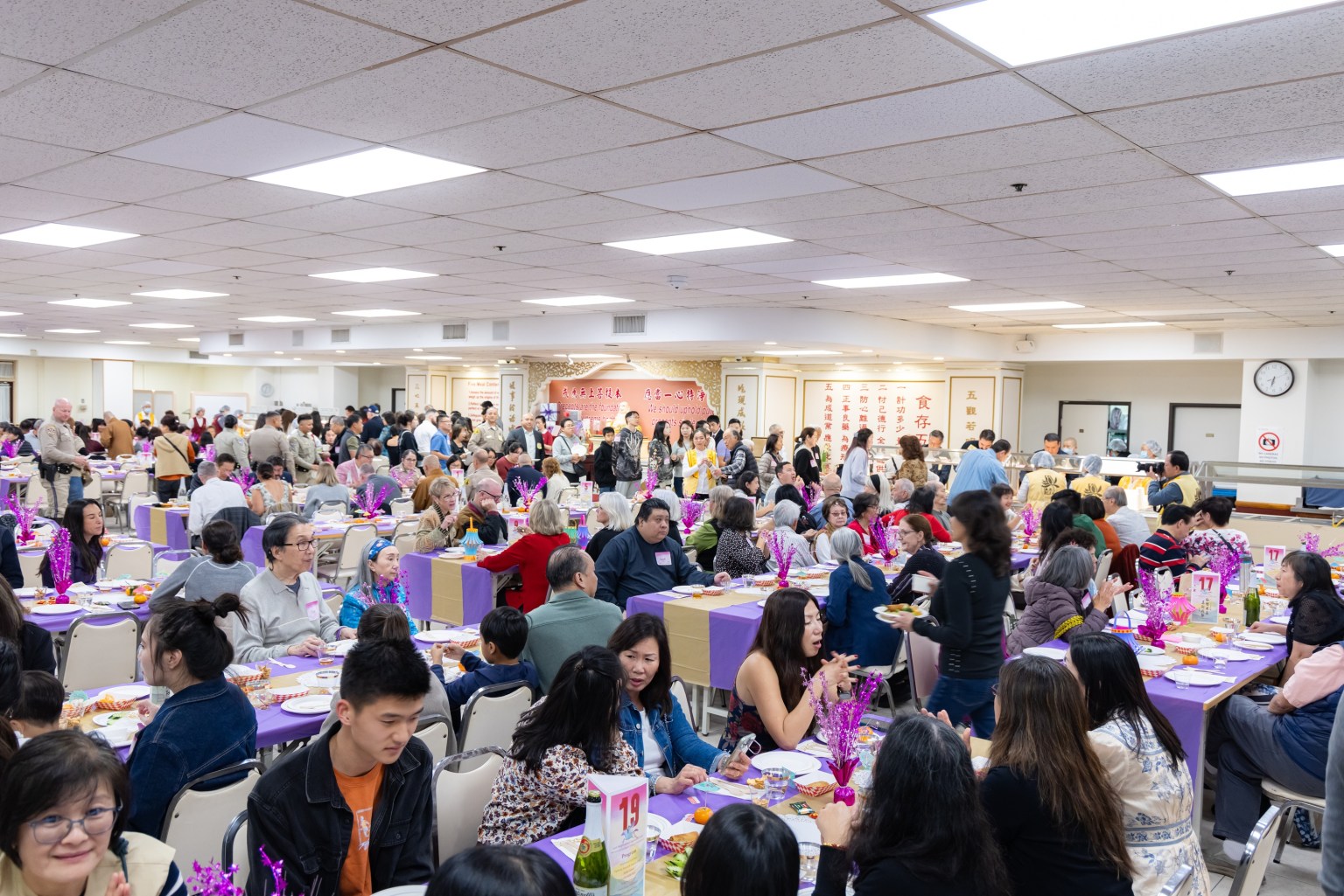The Dining Hall is filled to capacity with enthusiastic participants.