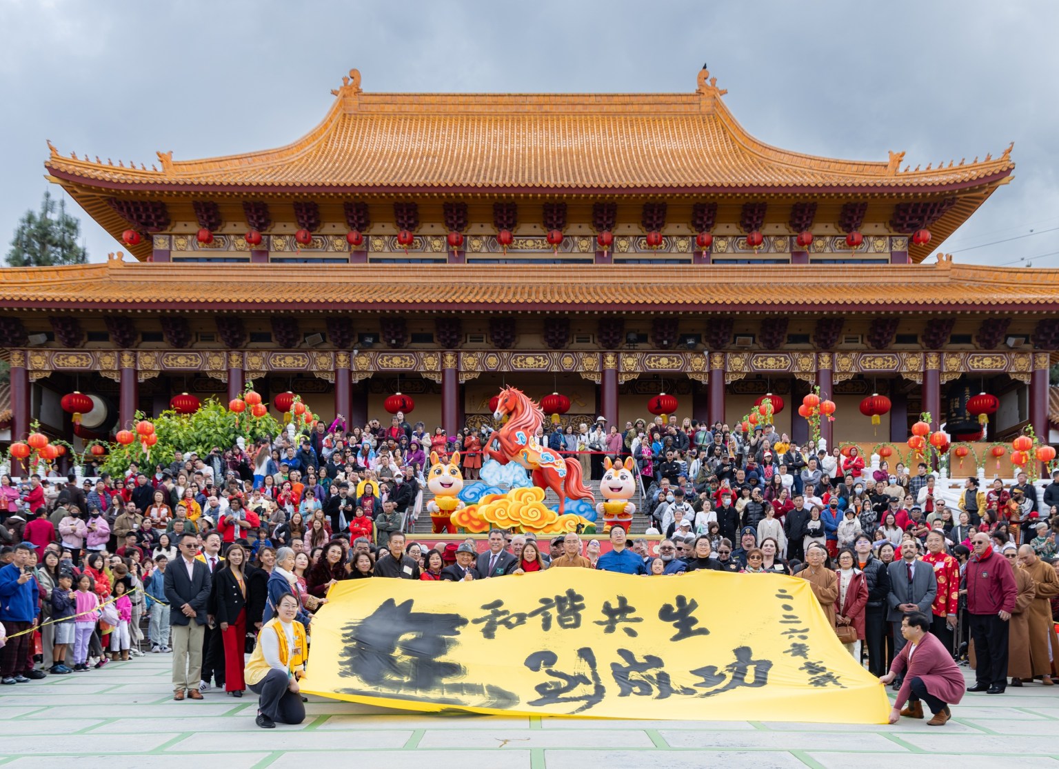 Calligraphy artist Pan Ching-Chung demonstrated the art of ground calligraphy, creating large Chinese characters with graceful, flowing brushstrokes.