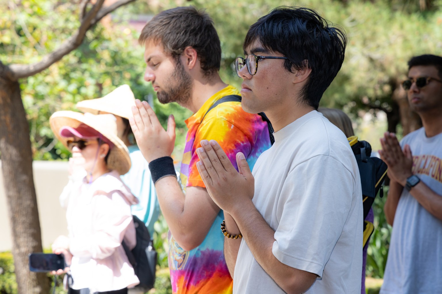 Participants join together in chanting prayers for world peace.